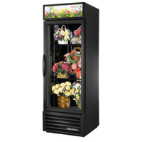 Black floral display refrigerator showcasing vibrant floral arrangements in a sleek glass-door design.